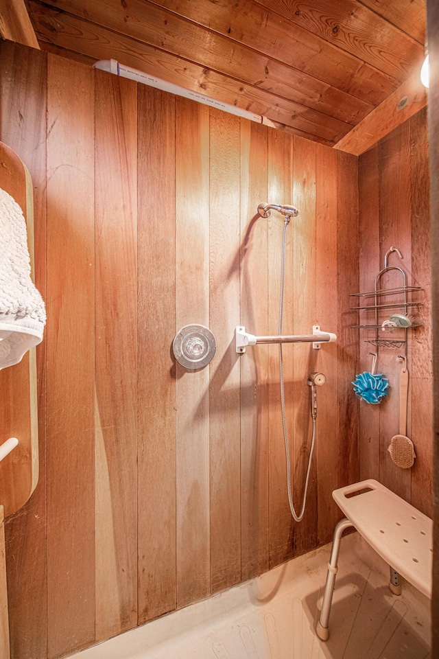 bathroom with wooden walls and wooden ceiling