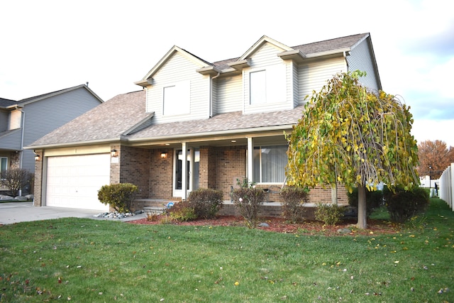 view of front of home featuring a garage and a front lawn