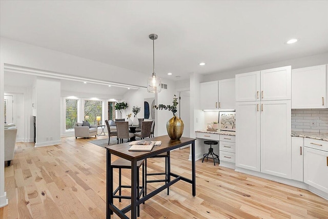 dining area with light hardwood / wood-style flooring