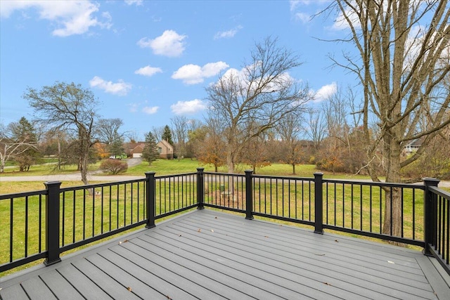 wooden terrace featuring a yard