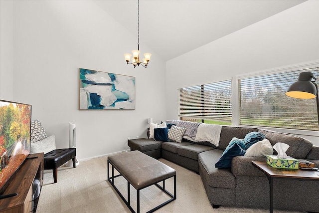 carpeted living room with a notable chandelier and high vaulted ceiling