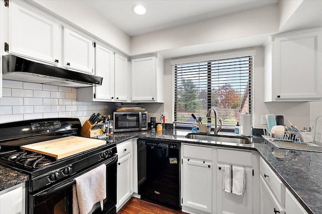 kitchen with black appliances, white cabinetry, and sink