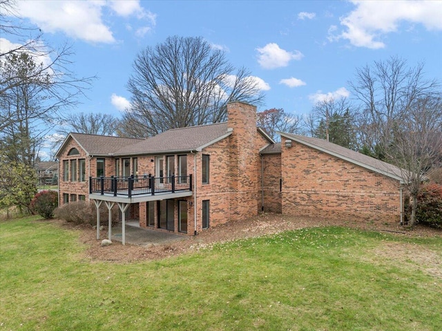 back of house with a lawn and a wooden deck