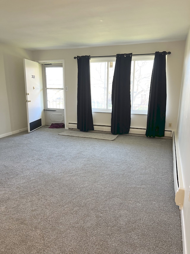 carpeted empty room with plenty of natural light