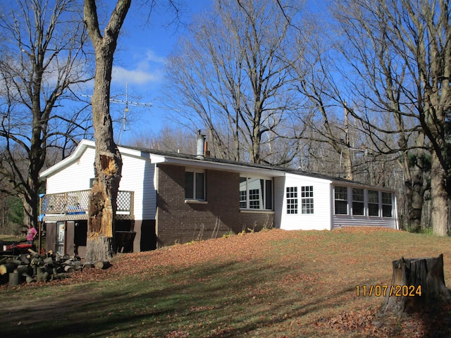 back of house featuring a lawn