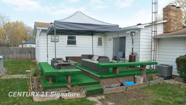 527 Leland St, Flushing, MI 48433 - back of property with cooling unit, a deck, and an outdoor hangout area
