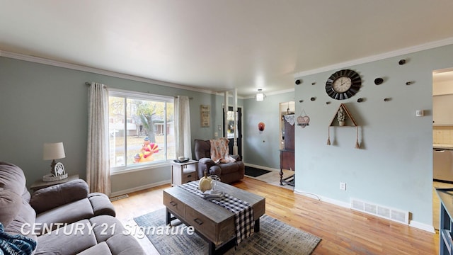 527 Leland St, Flushing, MI 48433 - living area featuring light wood-style flooring, ornamental molding, and baseboards