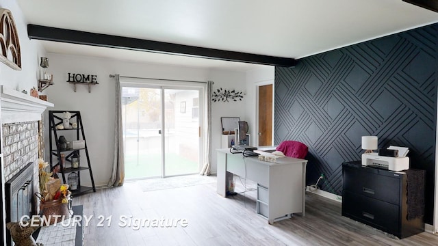 527 Leland St, Flushing, MI 48433 - office space with a fireplace, an accent wall, wood finished floors, beam ceiling, and baseboards