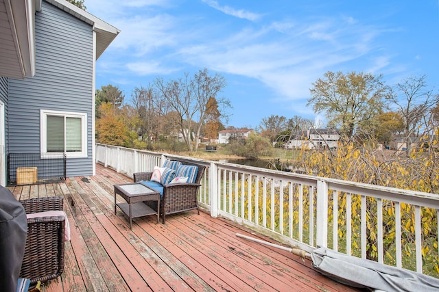 wooden terrace with outdoor lounge area