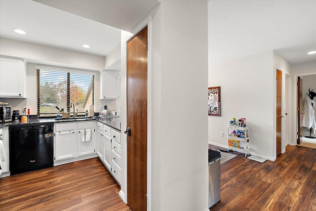 kitchen featuring sink, dark hardwood / wood-style flooring, white cabinets, and black dishwasher