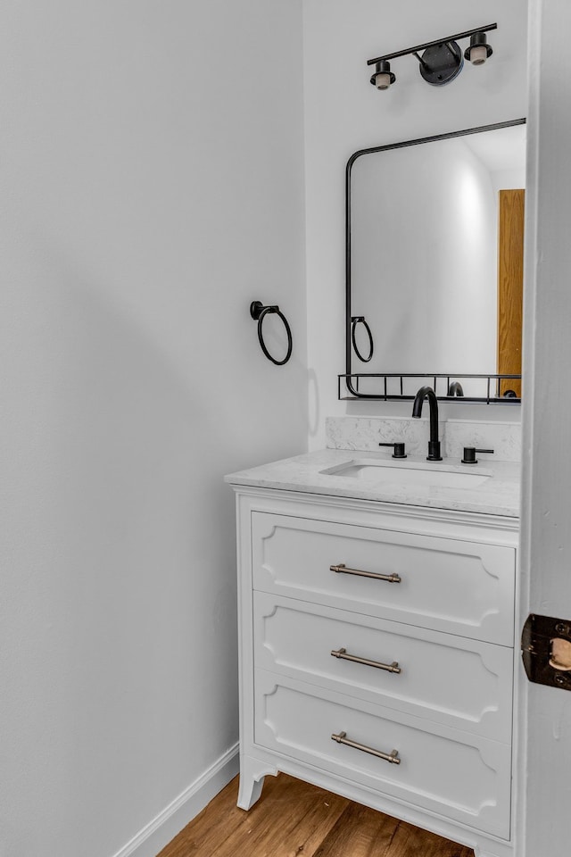 bathroom featuring hardwood / wood-style floors and vanity