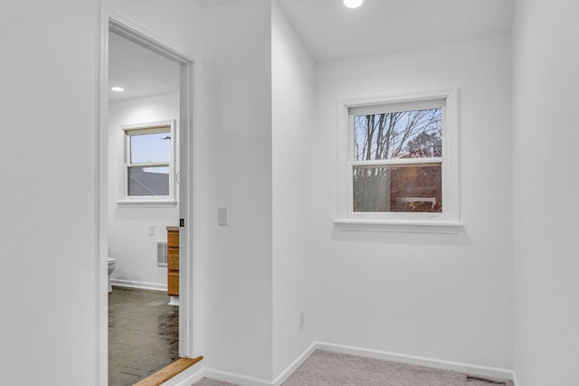 corridor featuring carpet floors