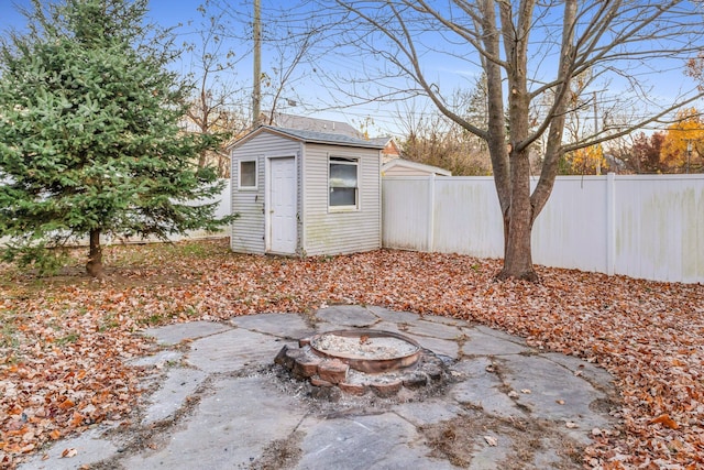 view of outdoor structure with a fire pit