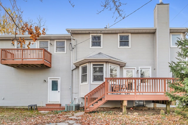 back of property featuring a wooden deck and central air condition unit