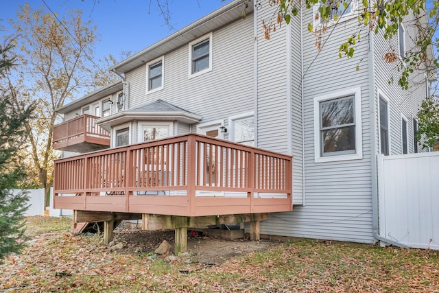 back of property with a wooden deck