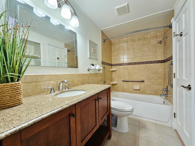 full bathroom featuring backsplash, tile walls, tile patterned flooring, toilet, and tiled shower / bath