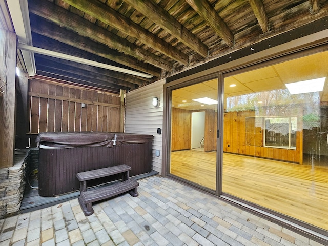 view of patio / terrace with a hot tub