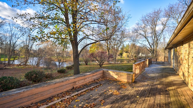 wooden deck featuring a water view