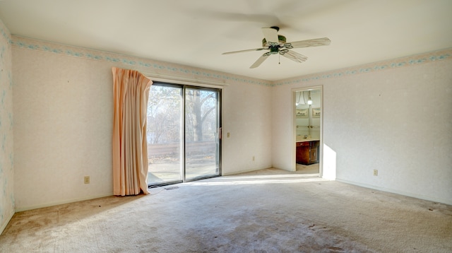 carpeted empty room with ceiling fan