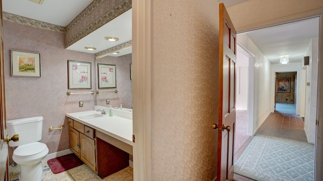 bathroom with tile patterned floors, vanity, and toilet