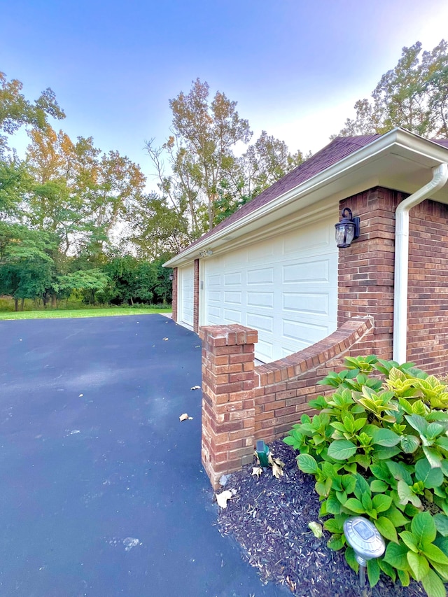 view of side of home with a garage