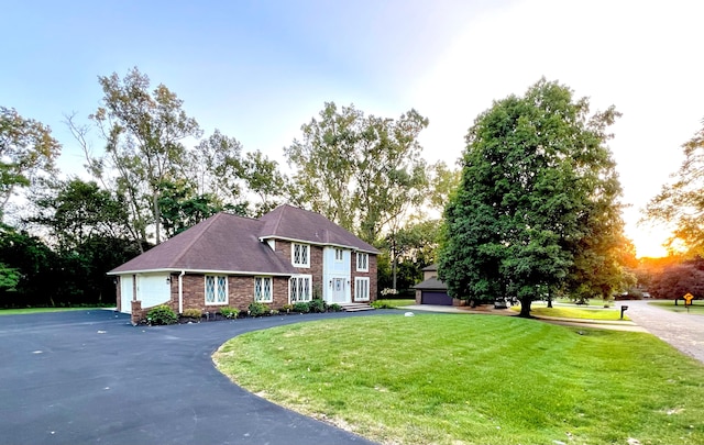 view of front facade with a front lawn and a garage