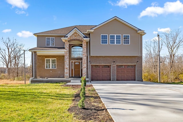 view of front facade with a garage and a front lawn