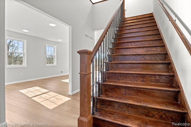 stairway featuring hardwood / wood-style floors