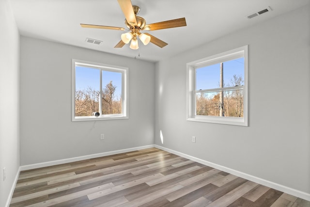 unfurnished room featuring ceiling fan and light hardwood / wood-style floors