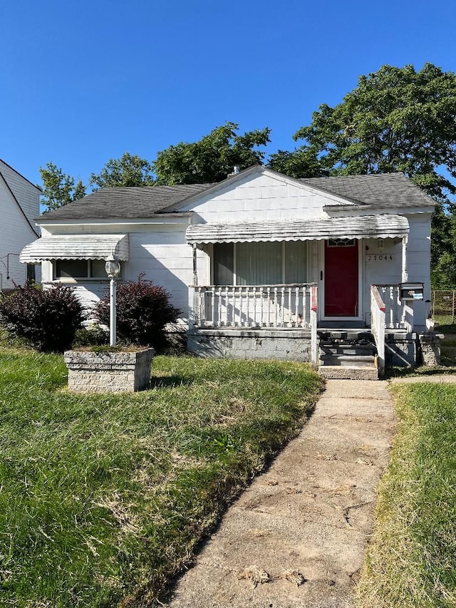 view of front of property with a front lawn and a porch