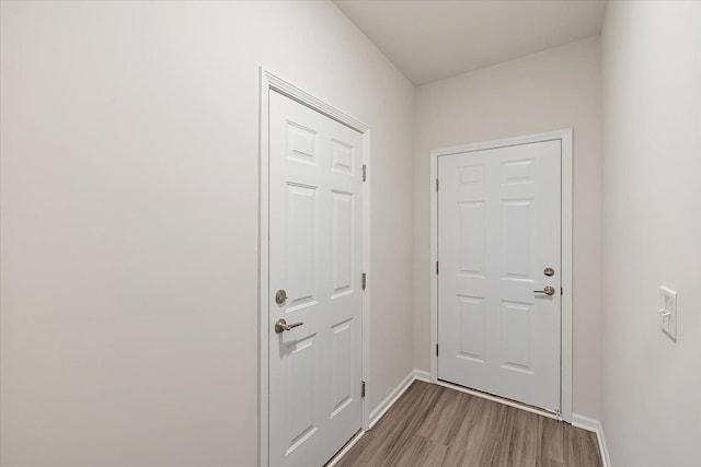 doorway with light hardwood / wood-style flooring