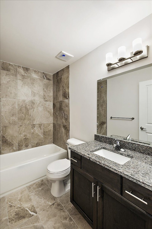 full bathroom featuring shower / bathing tub combination, vanity, and toilet