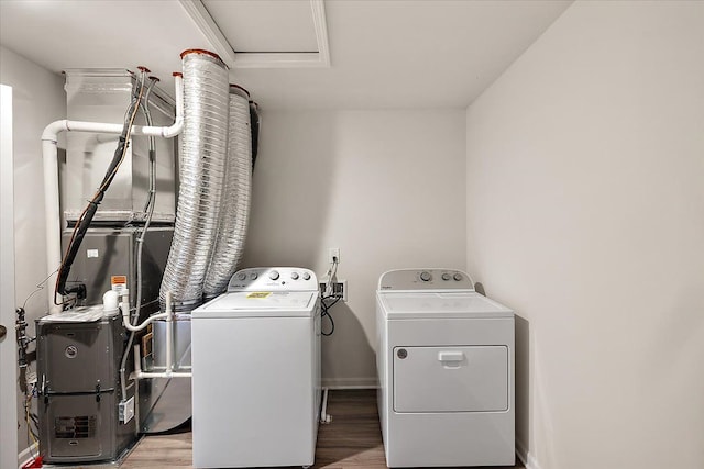 washroom featuring washer and dryer and hardwood / wood-style flooring