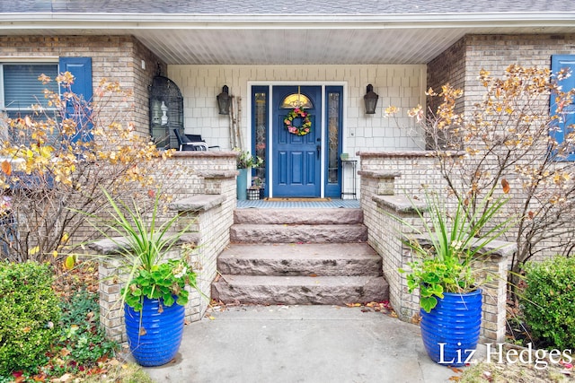 view of exterior entry featuring a porch