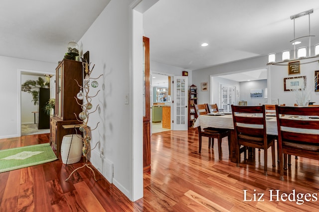 dining space featuring hardwood / wood-style flooring