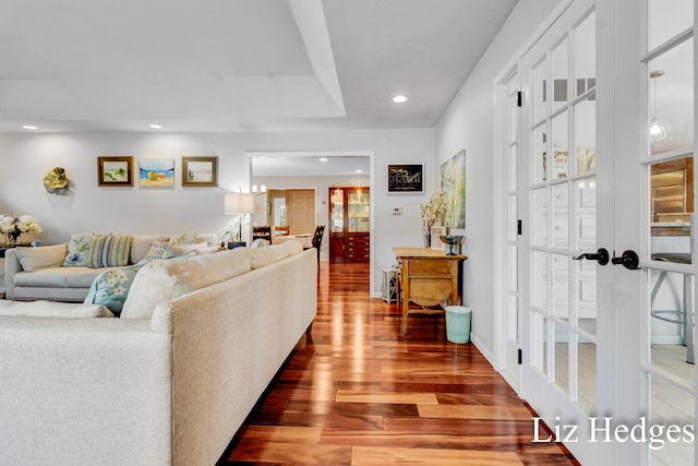 living room featuring french doors and hardwood / wood-style flooring