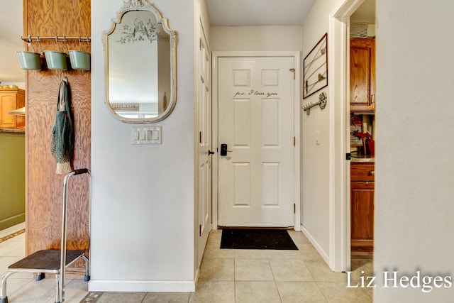 entryway with light tile patterned floors