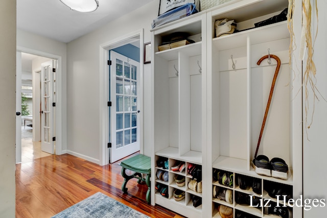 mudroom with hardwood / wood-style flooring