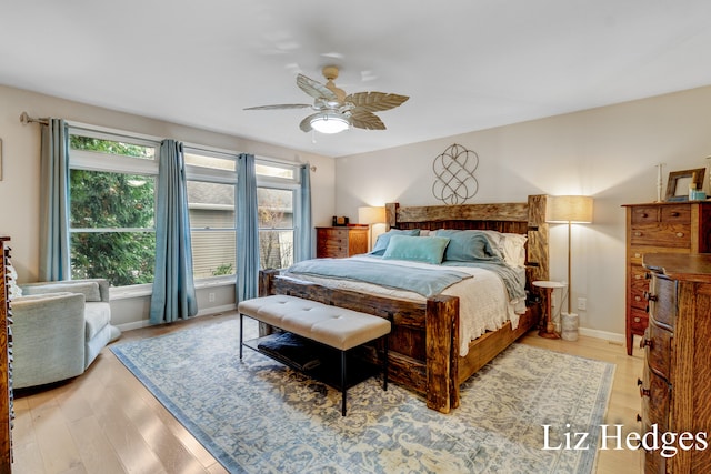 bedroom with ceiling fan and light hardwood / wood-style flooring