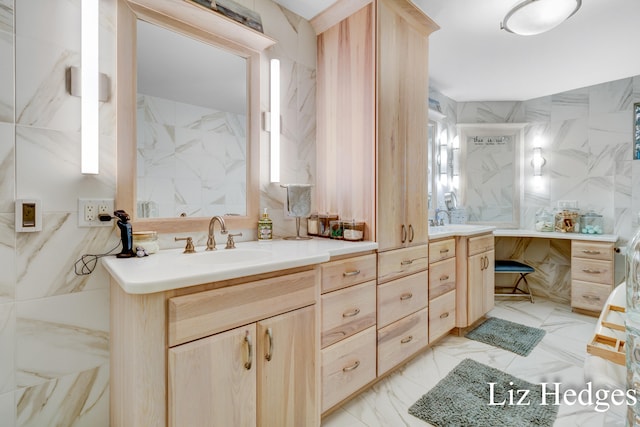 bathroom with vanity and tile walls