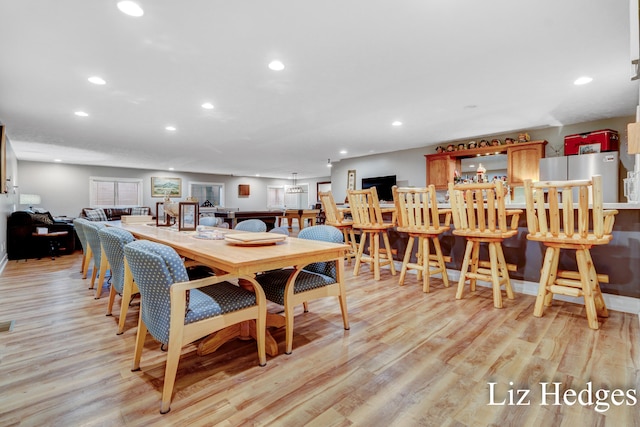 dining room with light hardwood / wood-style floors