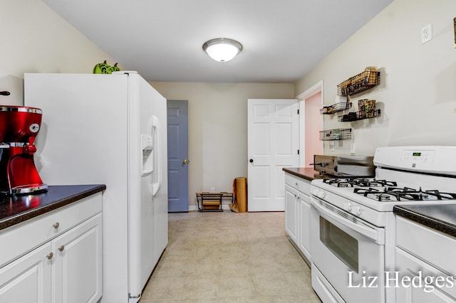 kitchen with white cabinets and white appliances