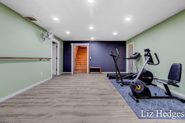 workout area featuring light hardwood / wood-style flooring