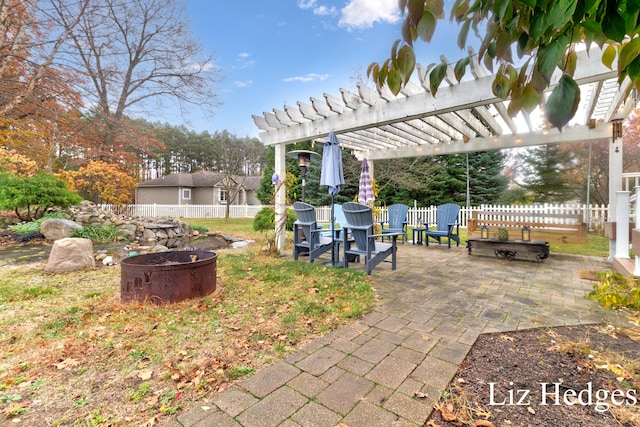 view of yard with a patio, a fire pit, and a pergola