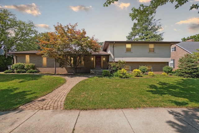 split level home featuring a front yard