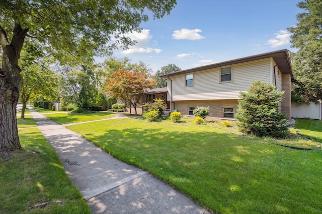 view of property exterior featuring a lawn