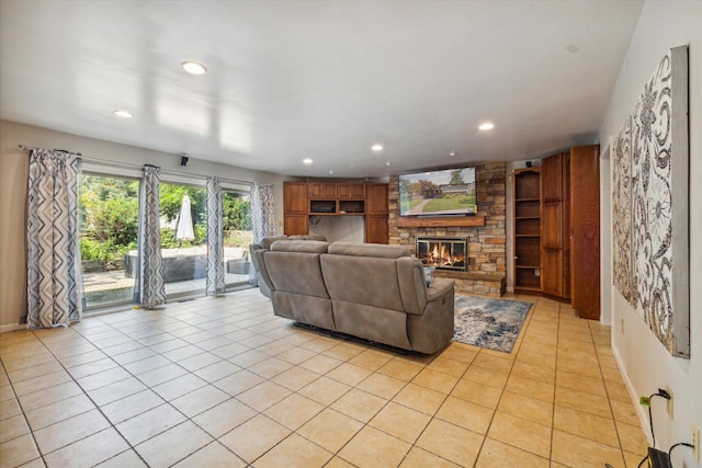 tiled living room featuring a stone fireplace