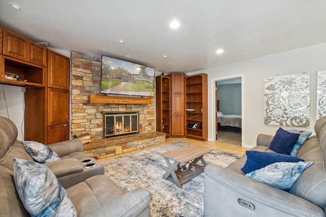 tiled living room featuring a fireplace