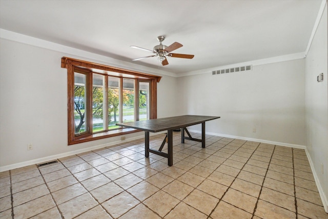 unfurnished office featuring ceiling fan, crown molding, and light tile patterned flooring