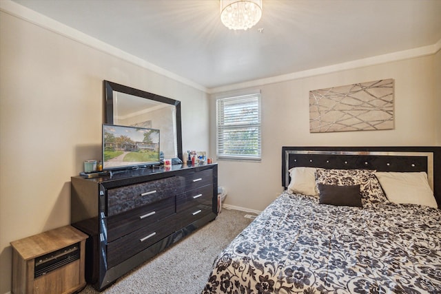 carpeted bedroom with a chandelier and crown molding